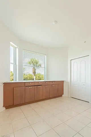 a kitchen with a refrigerator and a sink