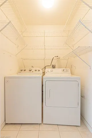 a view of a balcony with lake view and a floor to ceiling window