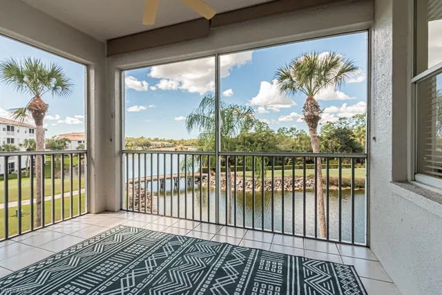 a view of a balcony with a floor to ceiling window and wooden floor