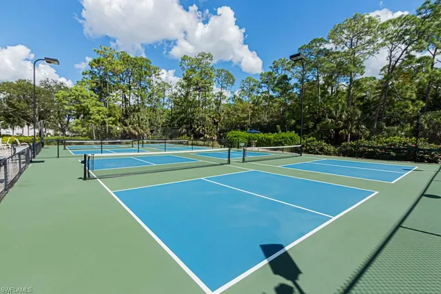 a view of a backyard with swimming pool