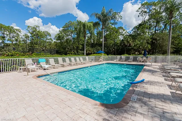 a view of a house with garden and patio
