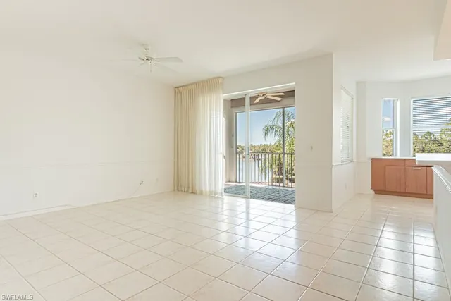 a view of an empty room and a window