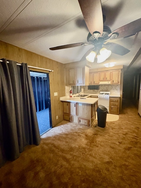 11-85 Woodhaven Sublette, IL 61367 - Photo 12 of 26 a large kitchen with a stove a refrigerator and a view of dining room