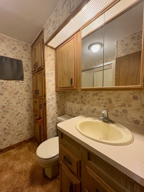 11-85 Woodhaven Sublette, IL 61367 - Photo 19 of 26 a bathroom with a sink a toilet and shower