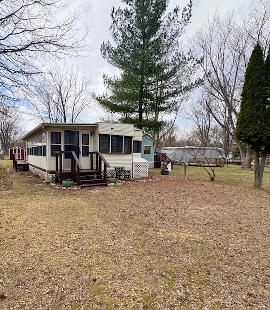 11-85 Woodhaven Sublette, IL 61367 - Photo 2 of 26 a view of a house with a yard covered with snow in front of house