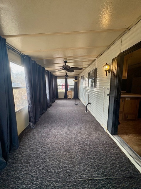 11-85 Woodhaven Sublette, IL 61367 - Photo 22 of 26 a view of hallway with stairs and wooden floor