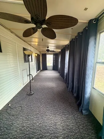 a view of a livingroom with a ceiling fan