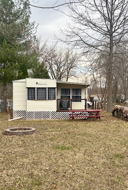 11-85 Woodhaven Sublette, IL 61367 - Photo 4 of 26 a front view of a house with a garden