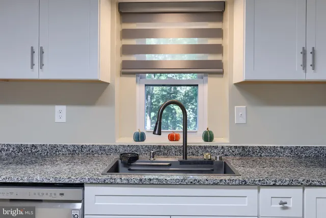 a view of empty room with windows