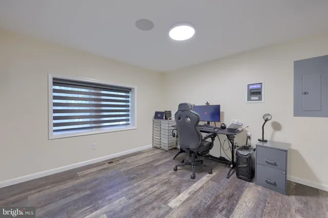 a bedroom with a bed and a lamp