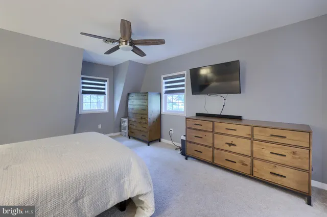 a bathroom with a double vanity sink and mirror