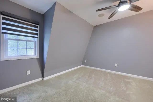 an empty room with fan