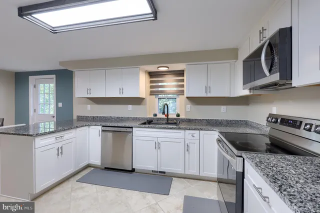 a view of a dining room with furniture and window