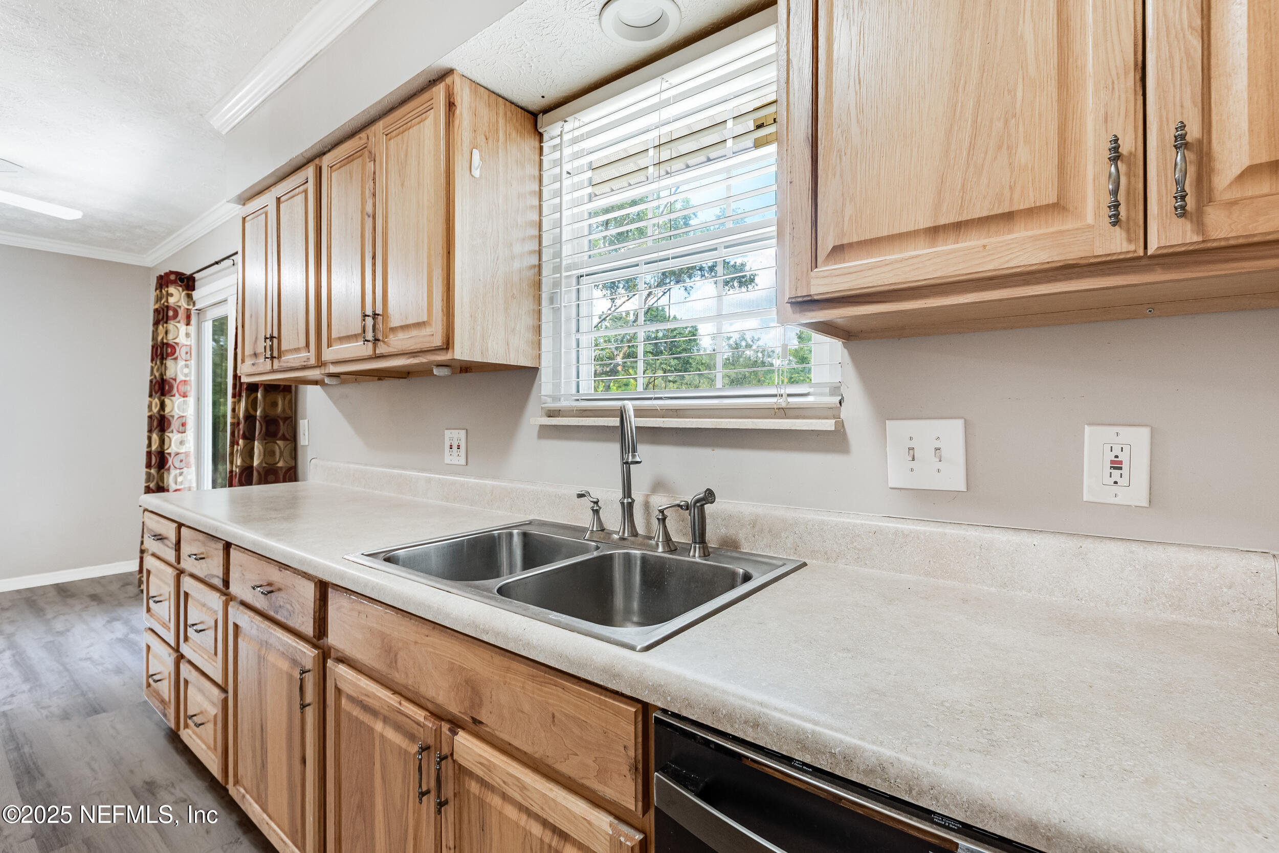 6149 Post Oak Road West Jacksonville, FL 32277 - Photo 14 of 25 a kitchen with granite countertop a sink and a window