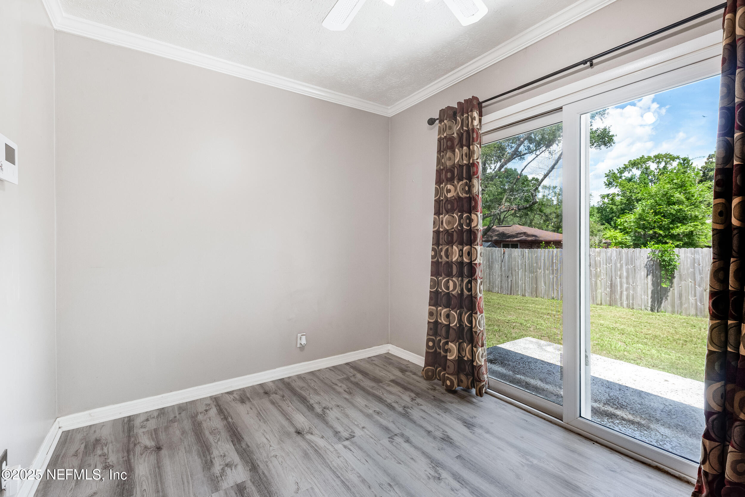 6149 Post Oak Road West Jacksonville, FL 32277 - Photo 15 of 25 a view of an empty room and wooden floor