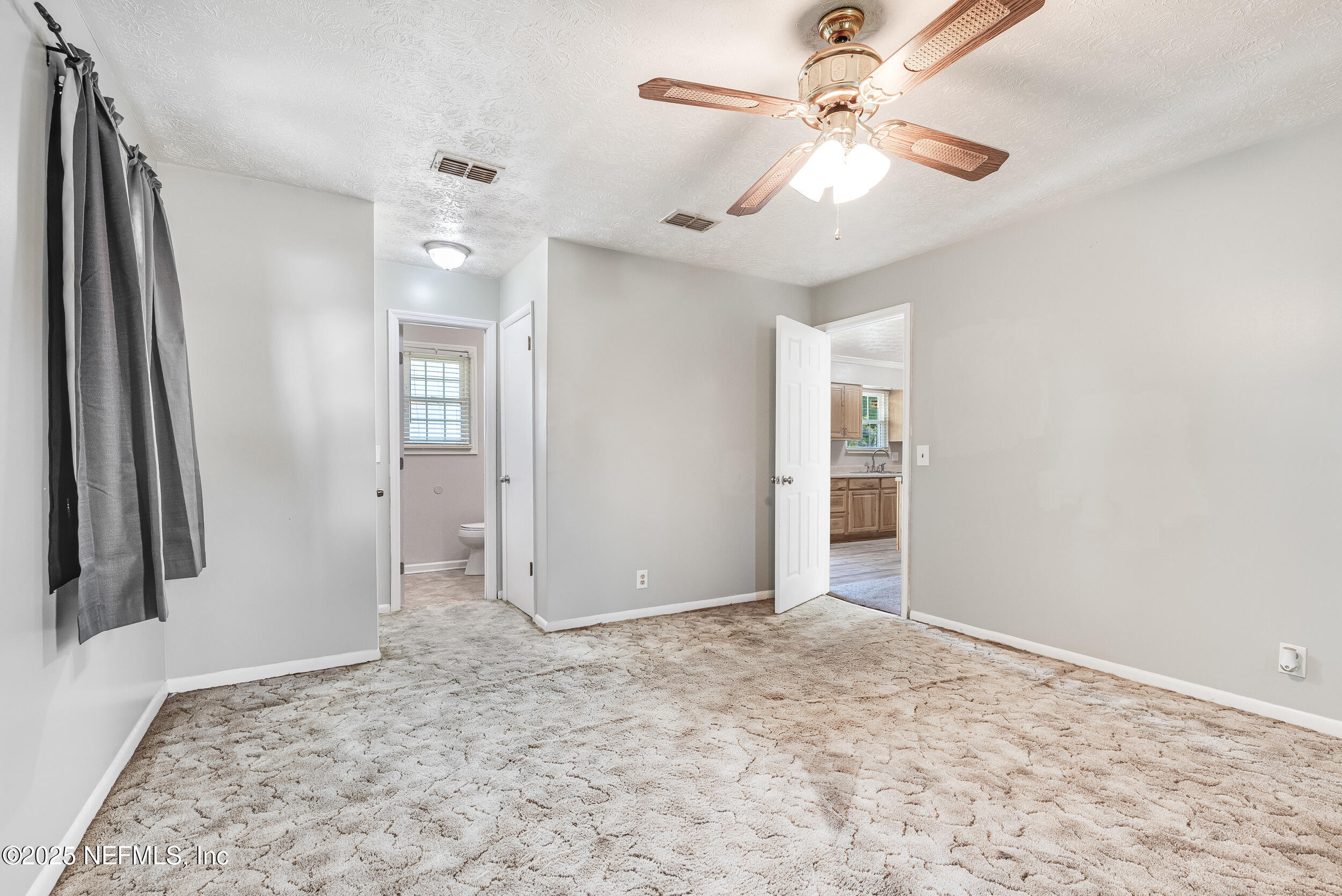 6149 Post Oak Road West Jacksonville, FL 32277 - Photo 17 of 25 wooden floor in an empty room with a window
