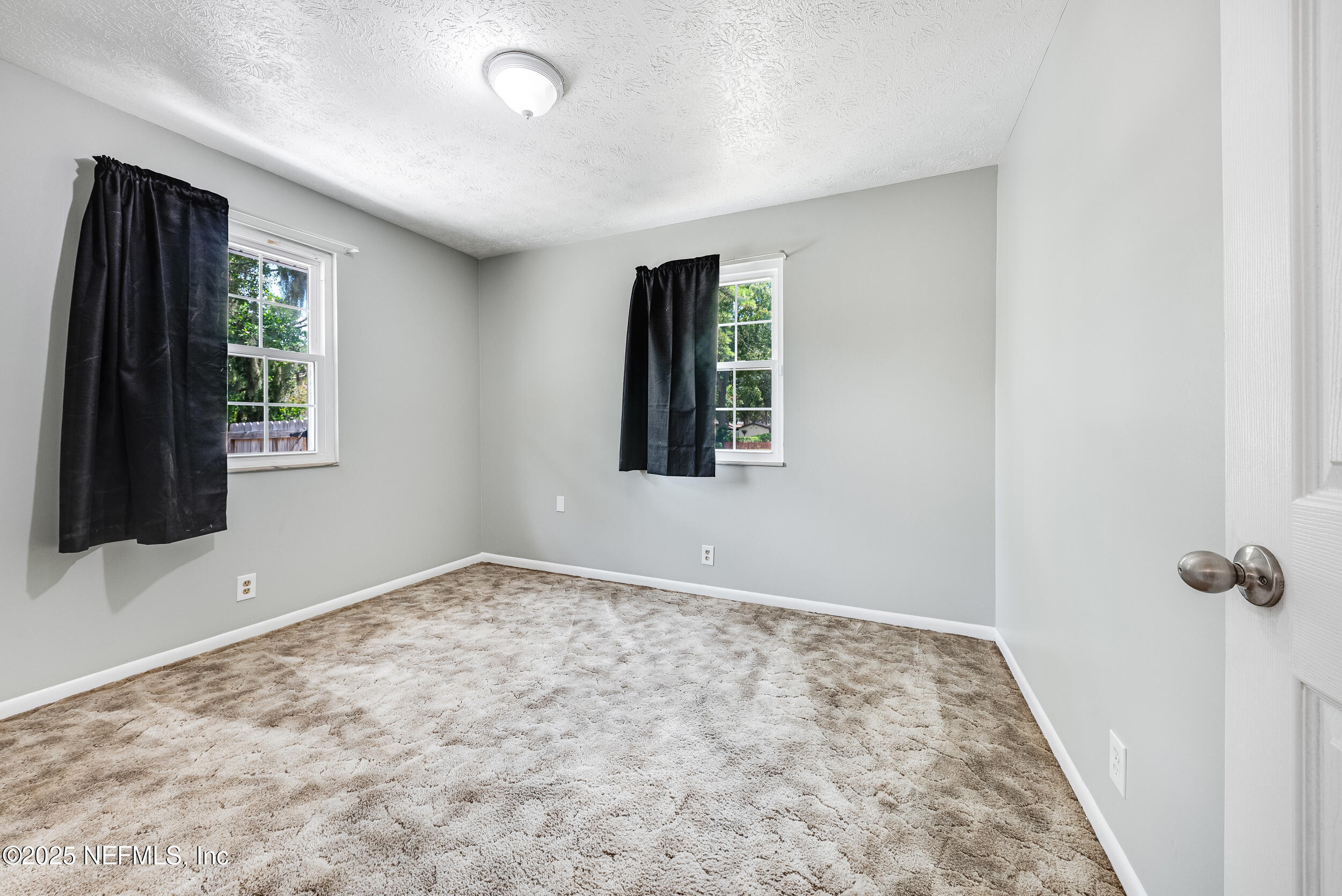 6149 Post Oak Road West Jacksonville, FL 32277 - Photo 20 of 25 an empty room with windows
