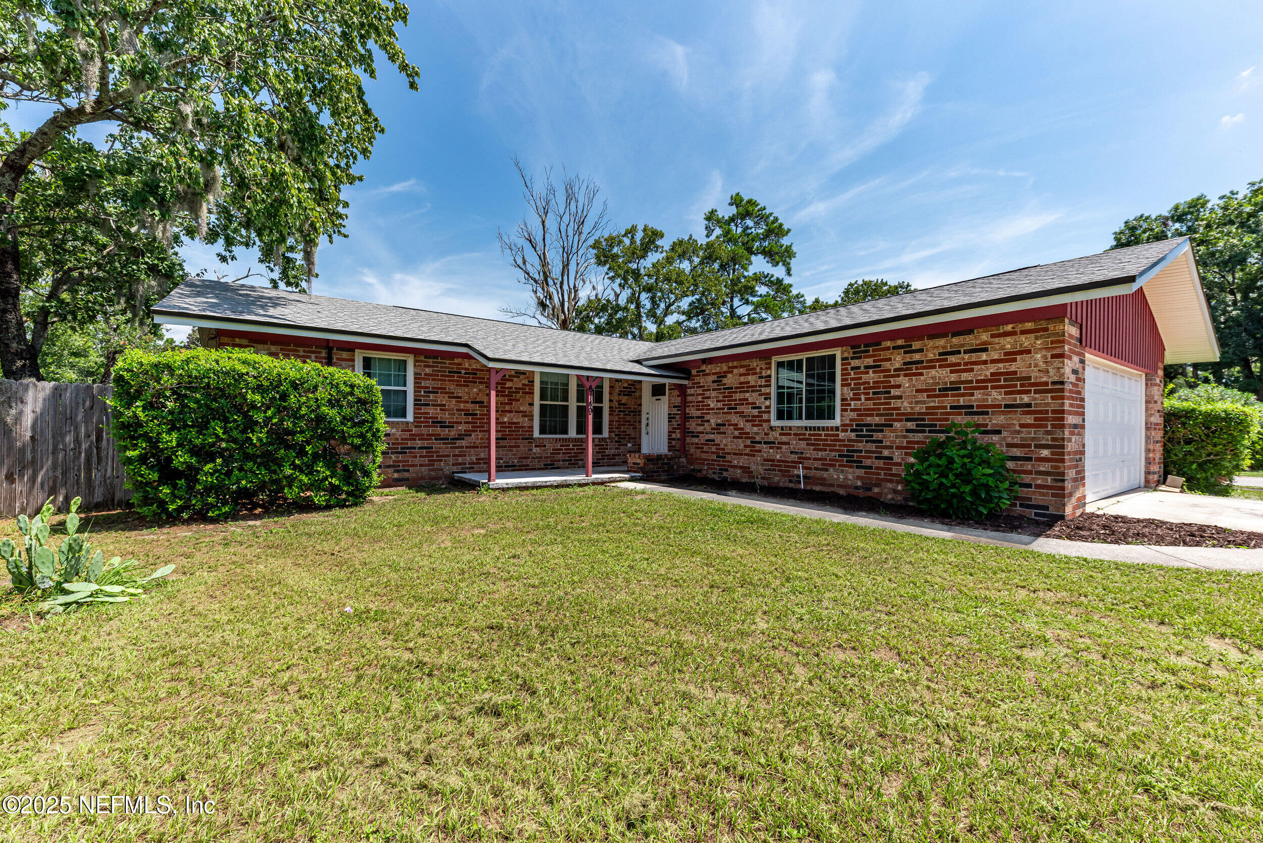 6149 Post Oak Road West Jacksonville, FL 32277 - Photo 2 of 25 front view of a house with a yard