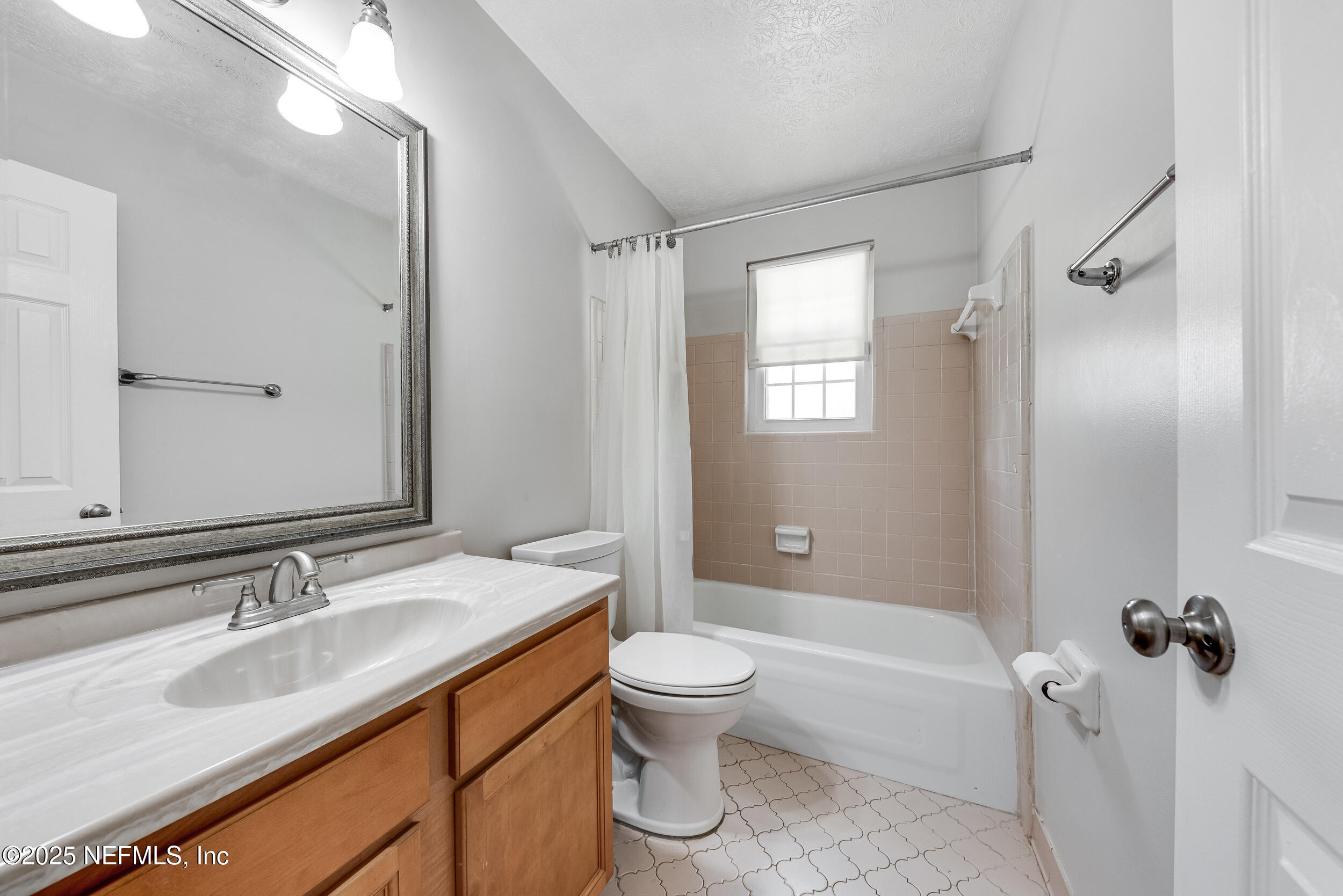 6149 Post Oak Road West Jacksonville, FL 32277 - Photo 22 of 25 a bathroom with a granite countertop sink toilet and shower