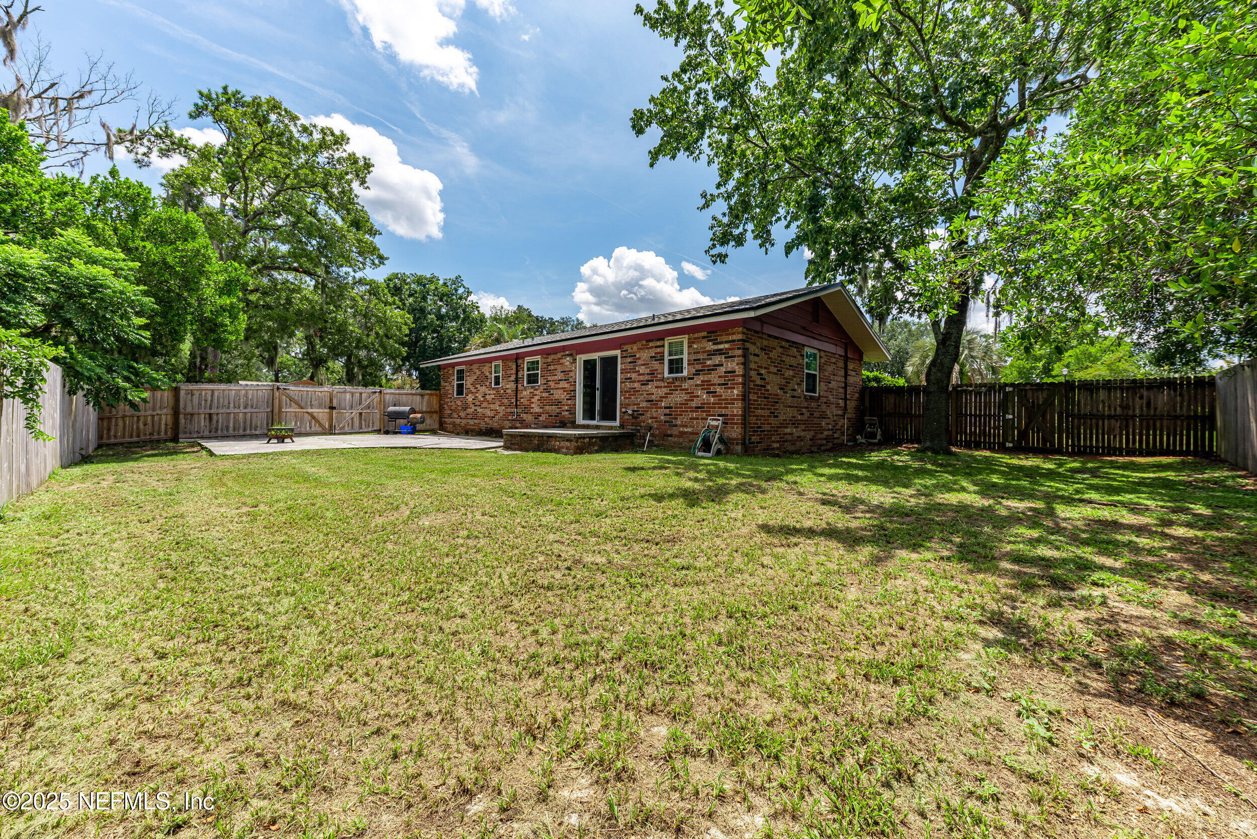 6149 Post Oak Road West Jacksonville, FL 32277 - Photo 23 of 25 a view of a house with a yard