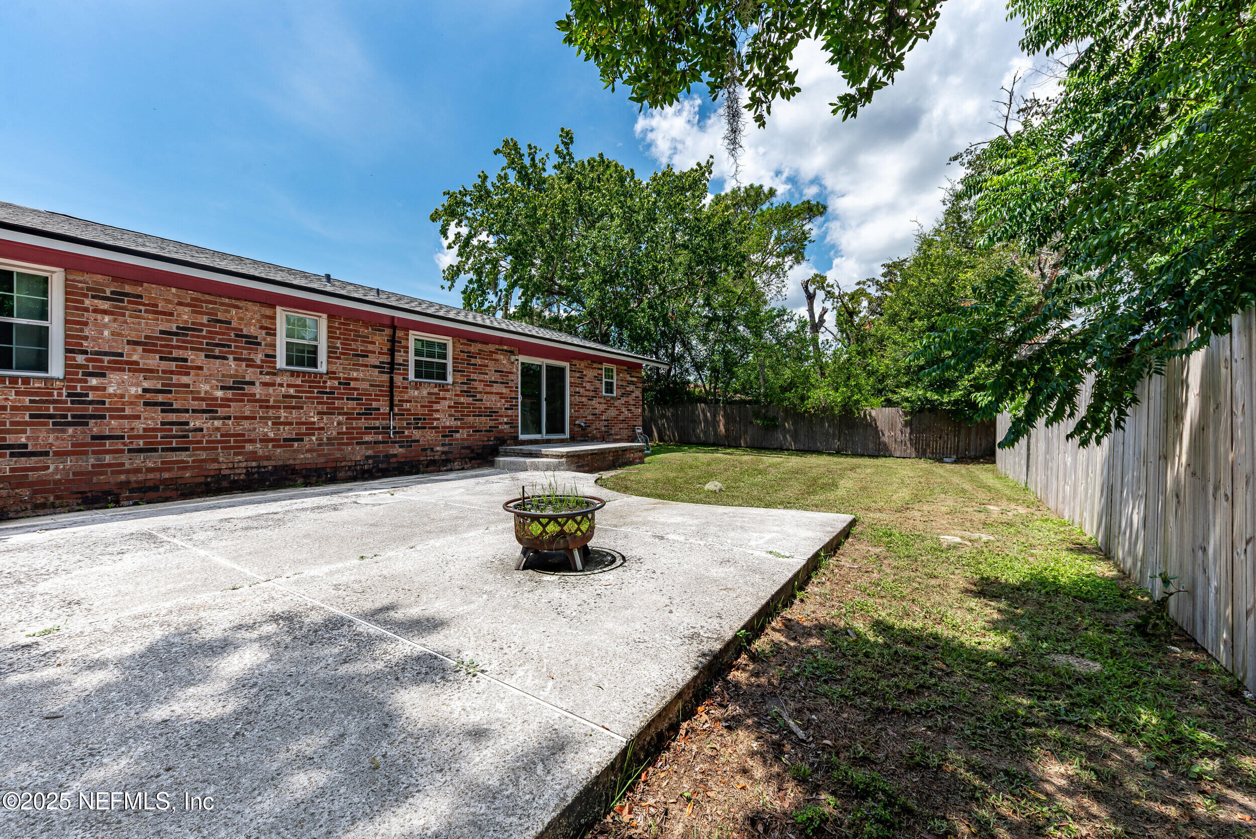 6149 Post Oak Road West Jacksonville, FL 32277 - Photo 24 of 25 a view of house with backyard and sitting area