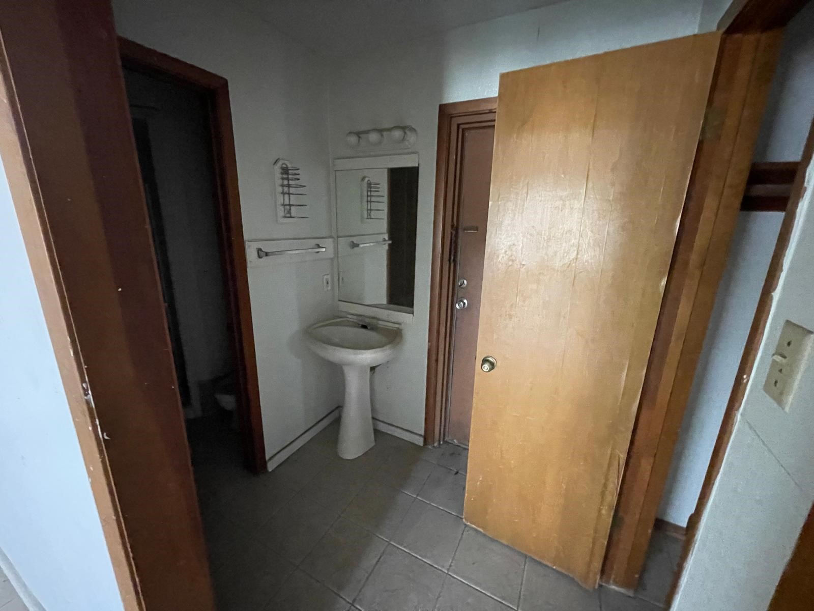 4602 Avenue H Rosenberg, TX 77471 - Photo 17 of 25 a bathroom with a granite countertop shower and a toilet