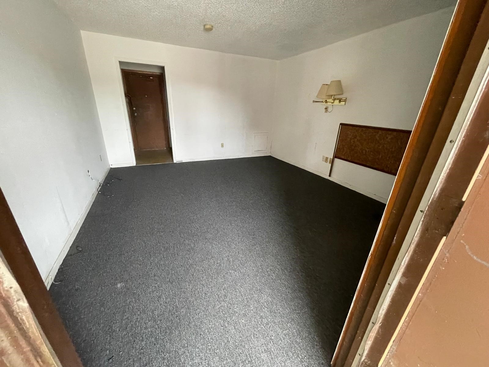 4602 Avenue H Rosenberg, TX 77471 - Photo 21 of 25 an empty room with wooden floor and windows