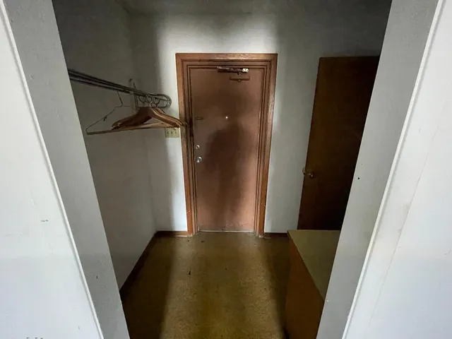 a bathroom with a shower and toilet