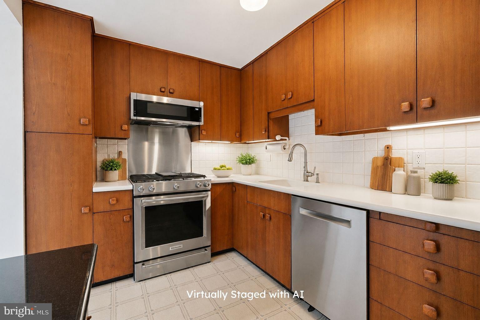 404 Old Farm Road Wyncote, PA 19095 - Photo 11 of 41 Modern kitchen with warm wood tones.