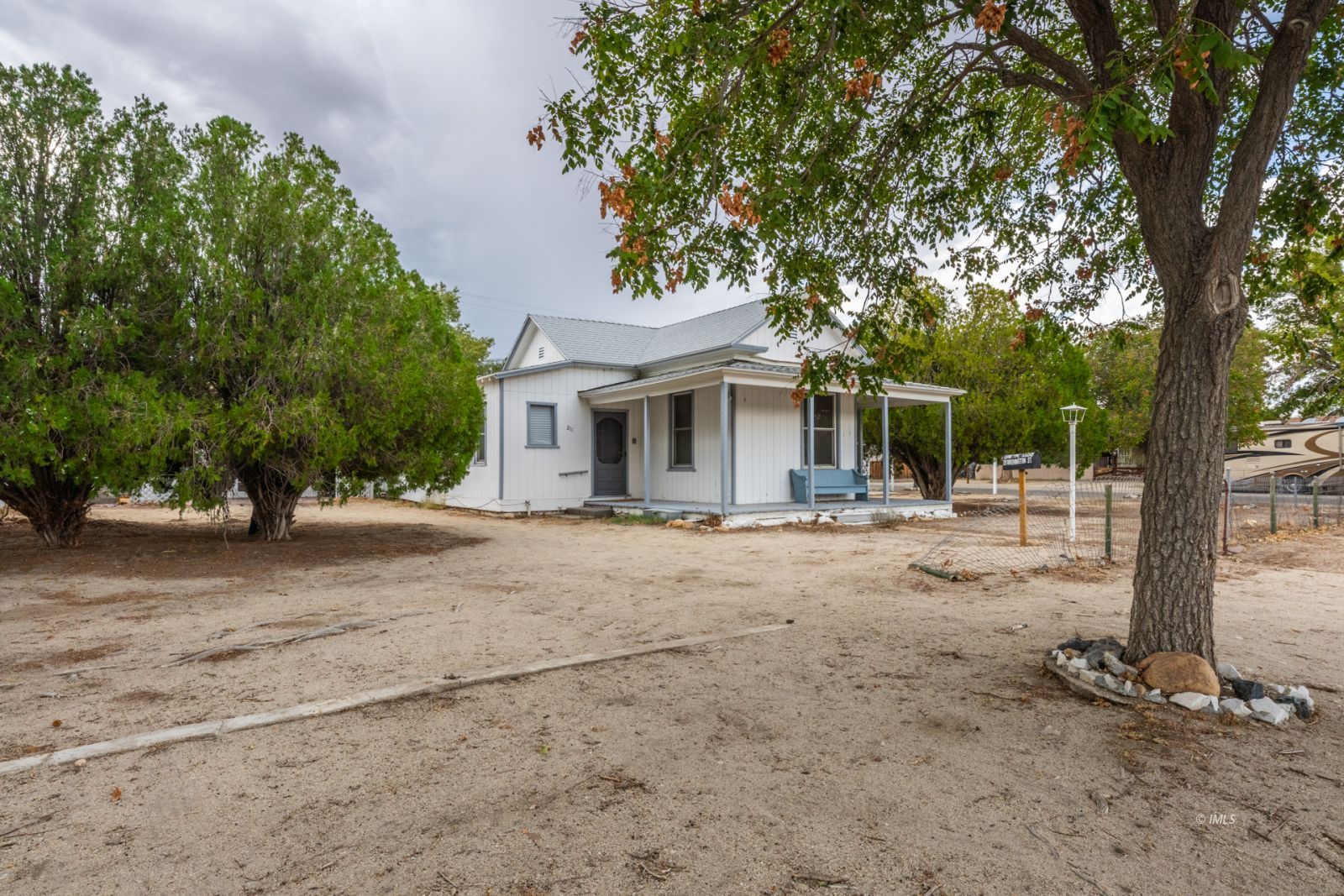 front view of a house with a tree