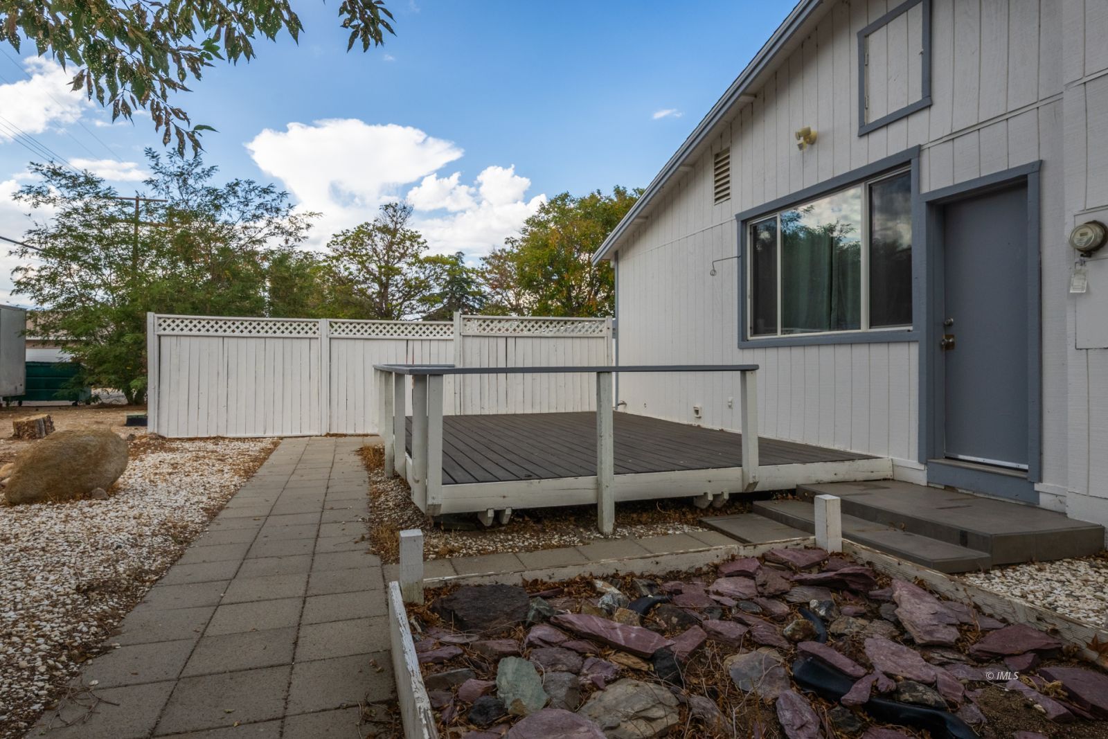 211 South Washington Street Lone Pine, CA 93545 - Photo 3 of 25 a backyard of a house with table and chairs