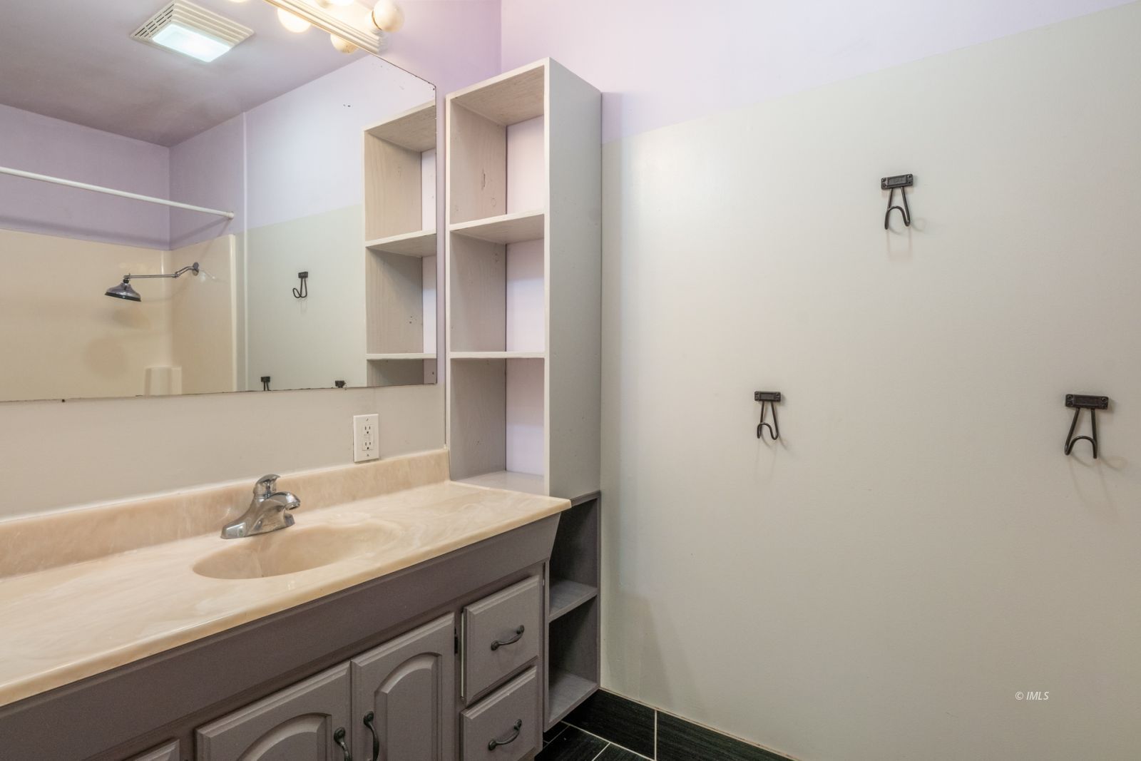 211 South Washington Street Lone Pine, CA 93545 - Photo 8 of 25 a bathroom with a sink and a mirror
