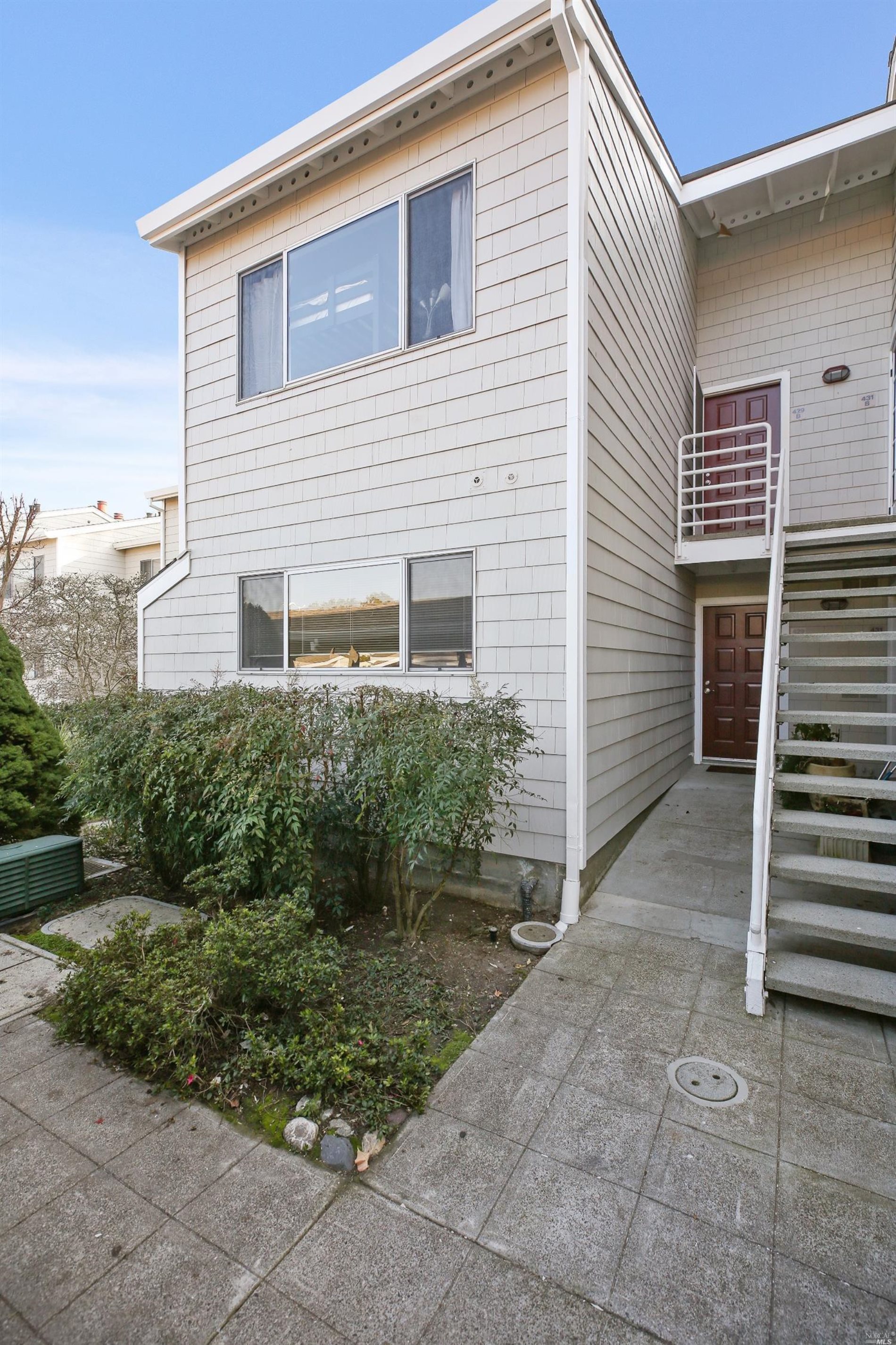 429 Enfrente Road, Unit B Novato, CA 94949 - Photo 1 of 1 a front view of a house with a yard