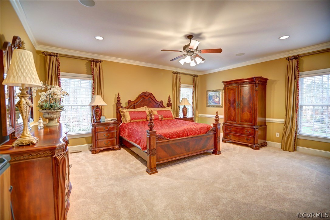 404 Wellfield Road Manakin-Sabot, VA 23103 - Photo 15 of 27 a bedroom with a bed and a chandelier