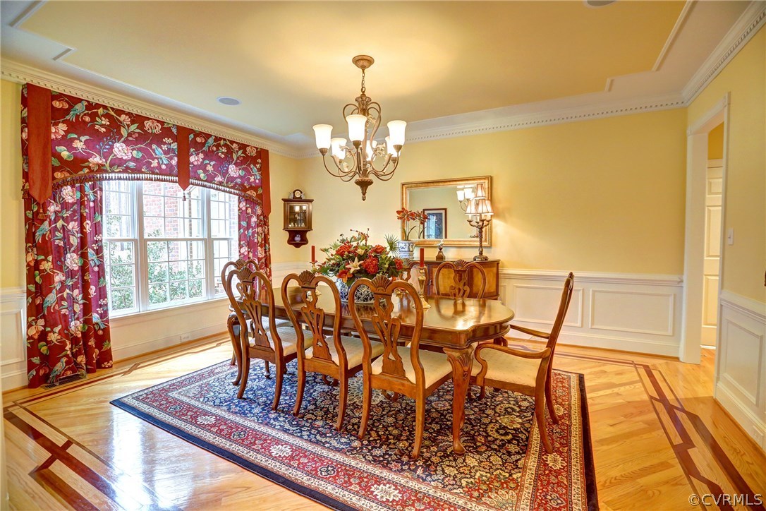 404 Wellfield Road Manakin-Sabot, VA 23103 - Photo 5 of 27 a view of a dining room with furniture a chandelier and wooden floor