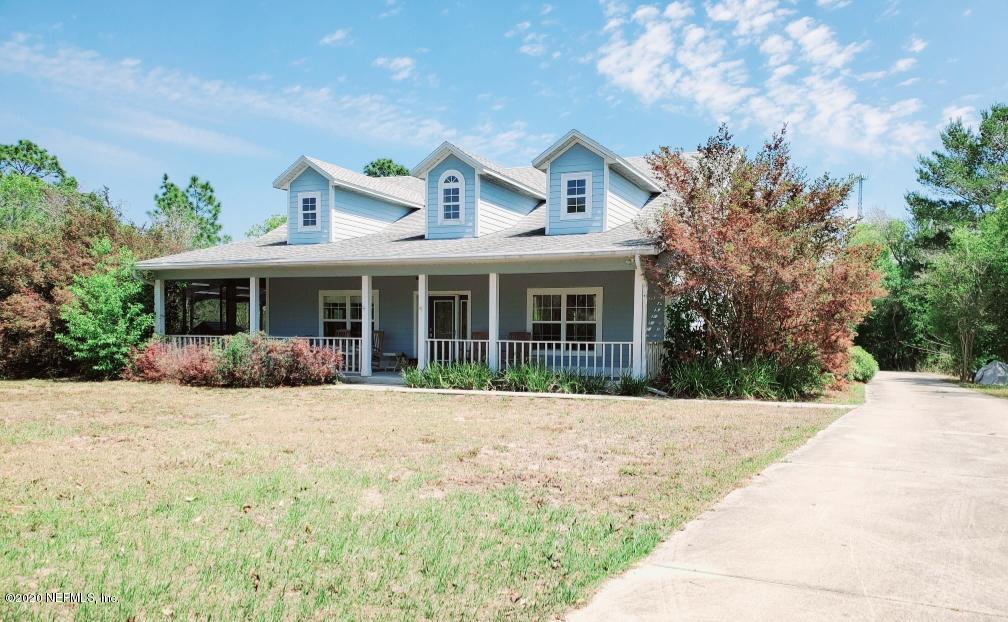7001 Elfo Road Keystone Heights, FL 32656 - Photo 1 of 6 a front view of a house with a yard