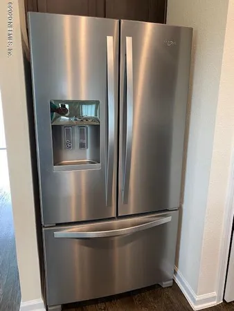 a view of a refrigerator in kitchen