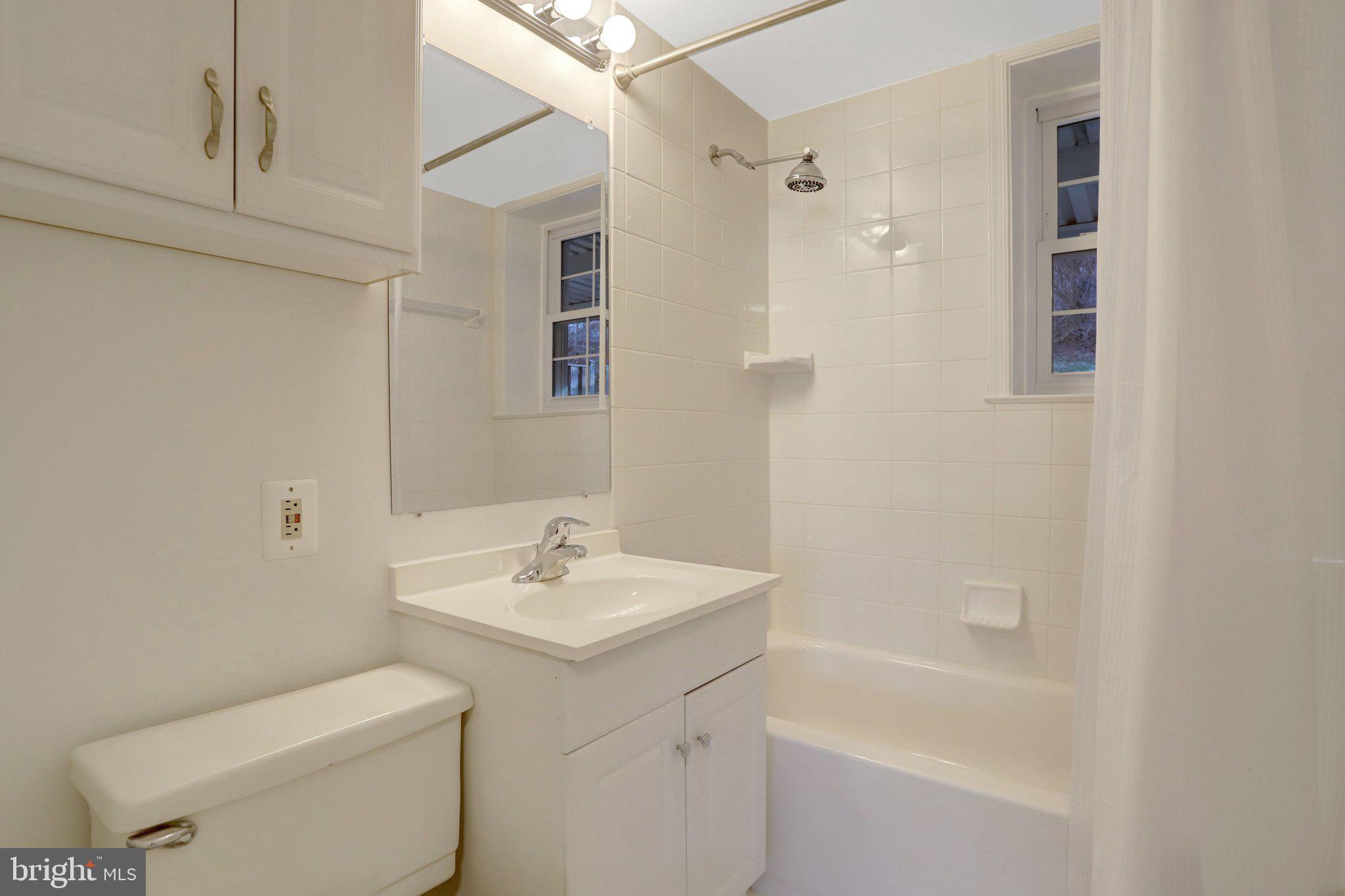 4619 28th Road South, Unit A Arlington, VA 22206 - Photo 25 of 30 a bathroom with a sink a toilet and shower