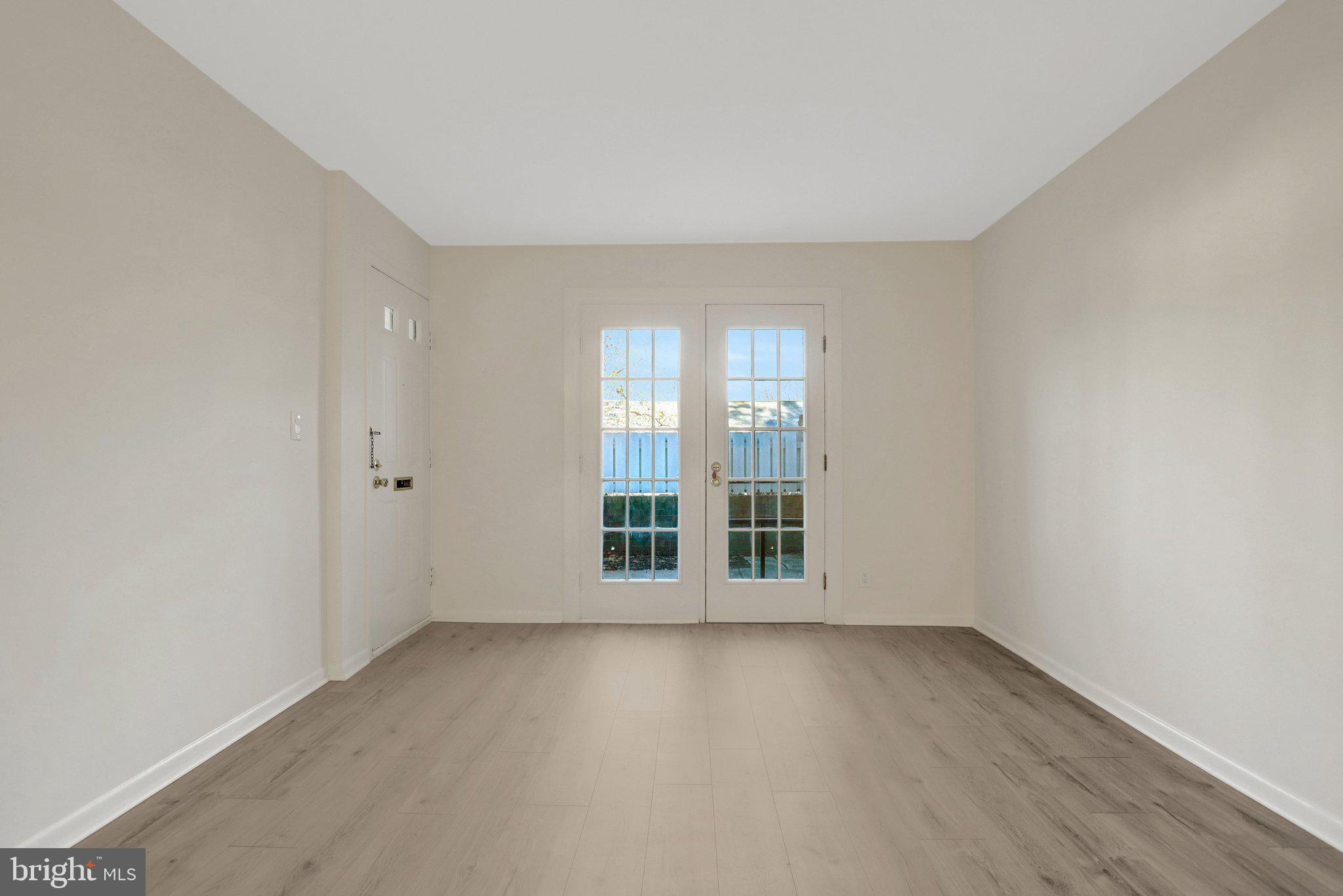 4619 28th Road South, Unit A Arlington, VA 22206 - Photo 6 of 30 wooden floor and window in an empty room