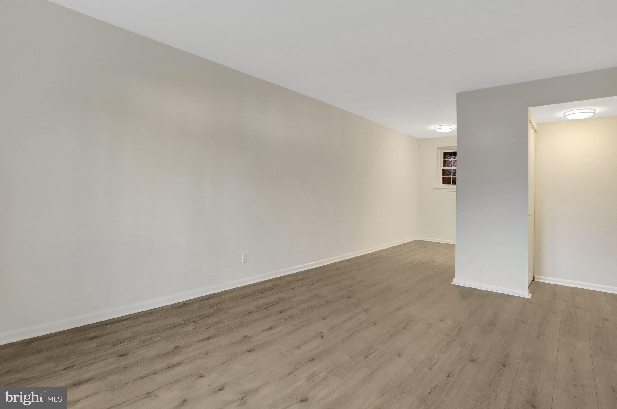 4619 28th Road South, Unit A Arlington, VA 22206 - Photo 8 of 30 an empty room with wooden floor