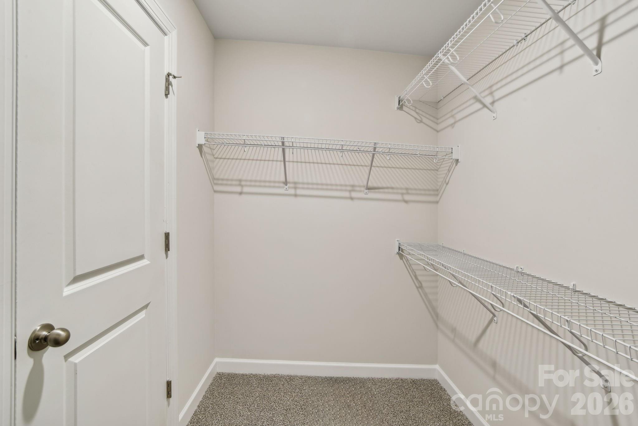 1284 30th St Lane Northeast Conover, NC 28613 - Photo 4 of 15 a view of walk in closet with empty racks