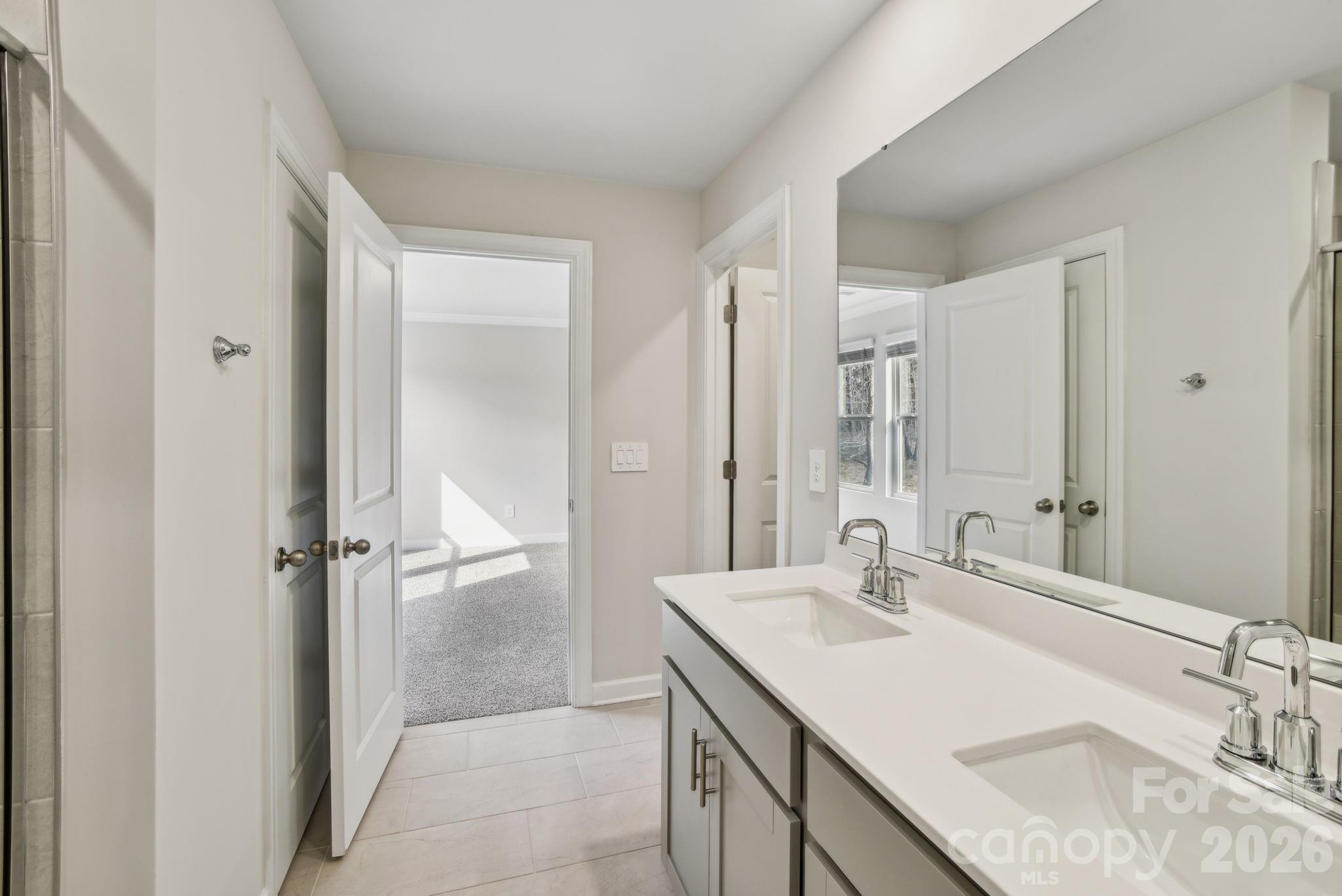 1284 30th St Lane Northeast Conover, NC 28613 - Photo 9 of 15 a bathroom with a granite countertop sink and a mirror