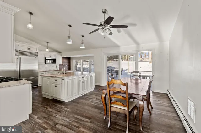 a view of a dining room with furniture and wooden floor