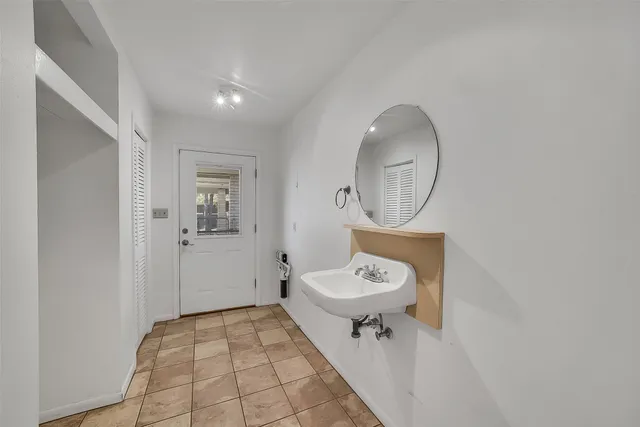 a bathroom with a bathtub and shower