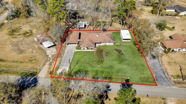 an aerial view of residential houses with outdoor space