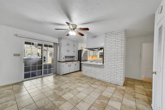 a kitchen with stainless steel appliances a sink and cabinets