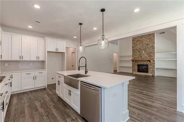 a bathroom with a bathtub a shower a sink and mirror