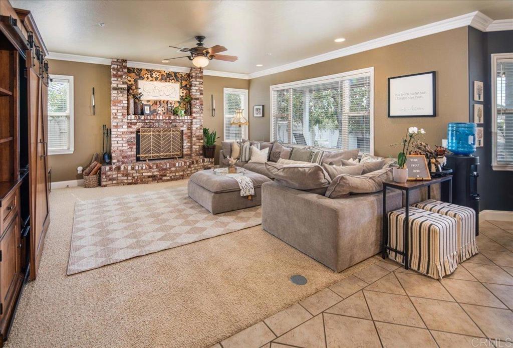 25057 Poderio Drive Ramona, CA 92065 - Photo 13 of 36 a living room with furniture and a large window