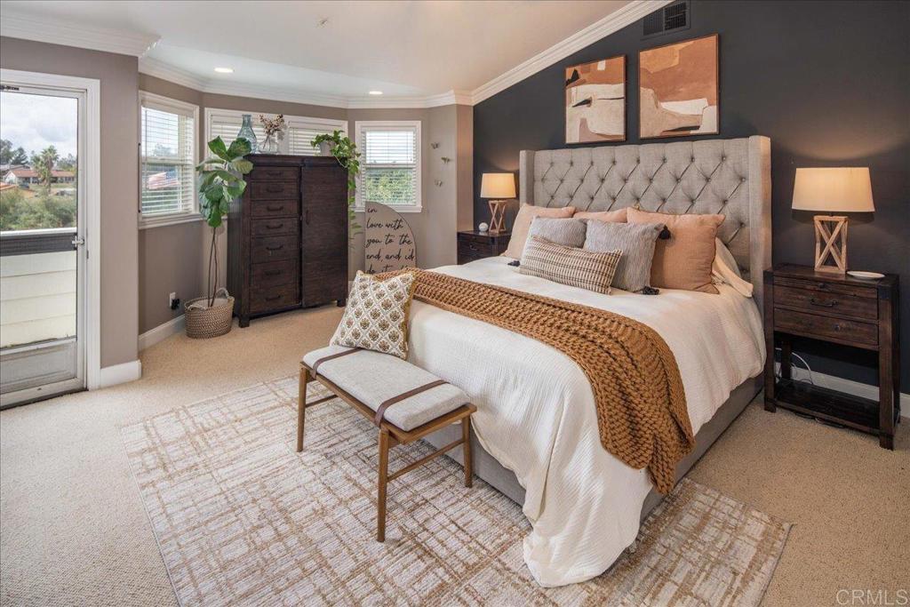 25057 Poderio Drive Ramona, CA 92065 - Photo 15 of 36 a spacious bedroom with a bed and glass door