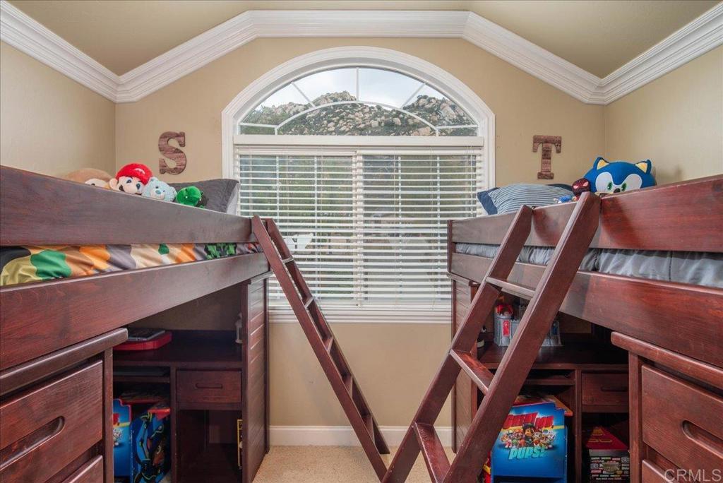 25057 Poderio Drive Ramona, CA 92065 - Photo 21 of 36 a view of an empty room with wooden floor and windows
